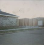 6' redwood fence w/brick retaining wall